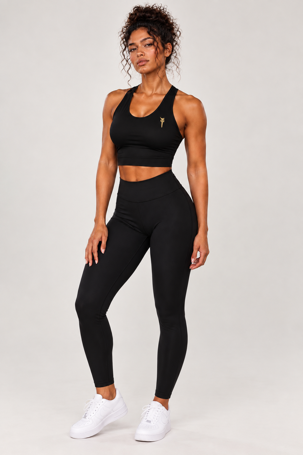 Black performance bra with black full-length leggings